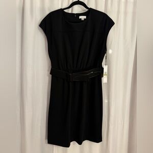 Calvin Klein Black dress with belt. Never won. New with tags.